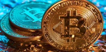 Bitcoin sert dle 54,000 dolara indi